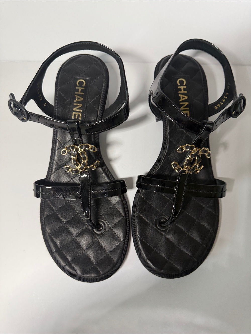 CHANEL Black Quilted Patent Leather T-Strap Sandals with Gold CC Chain